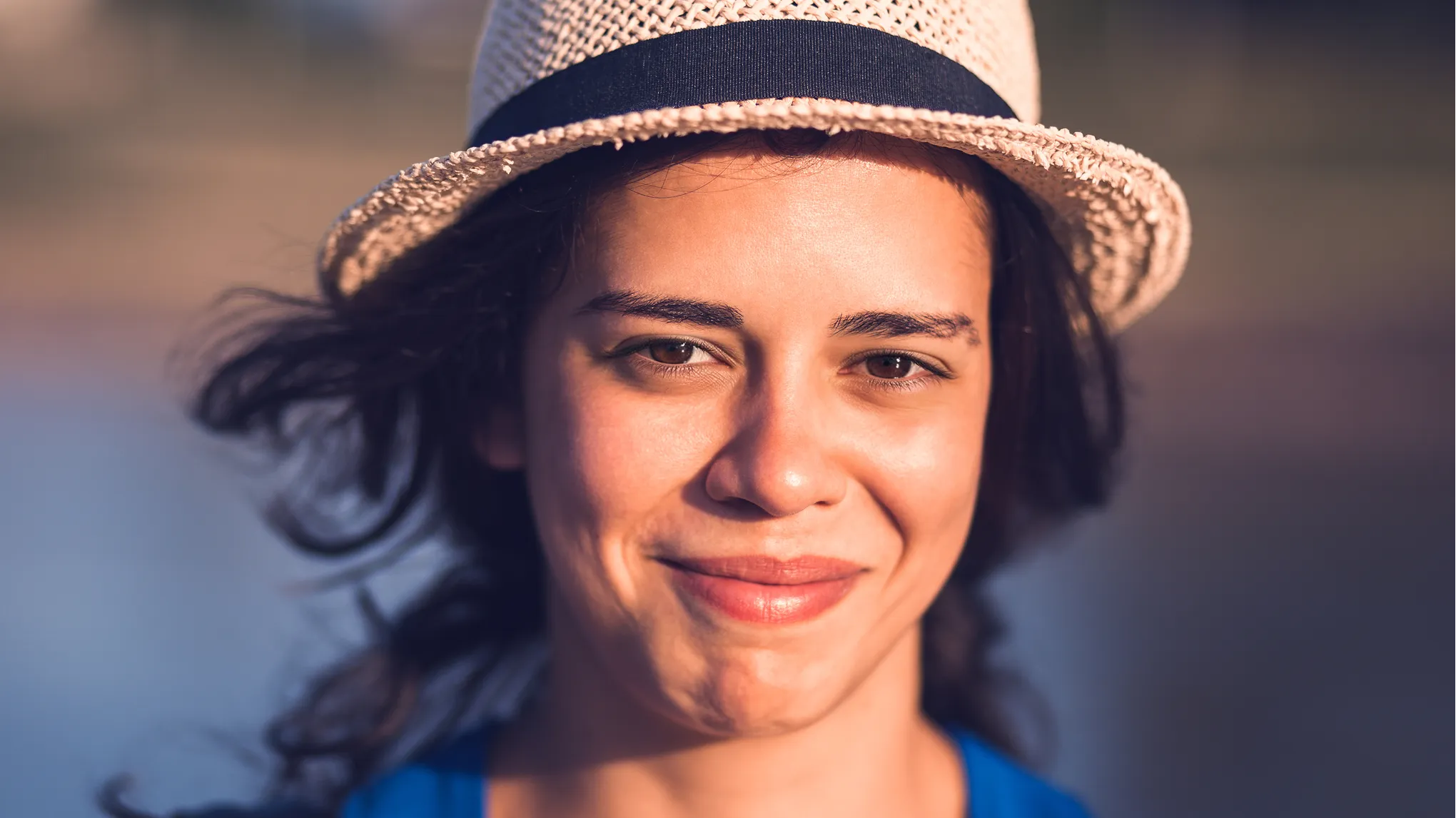Evoto example: the same straw-hat portrait with eyes open
