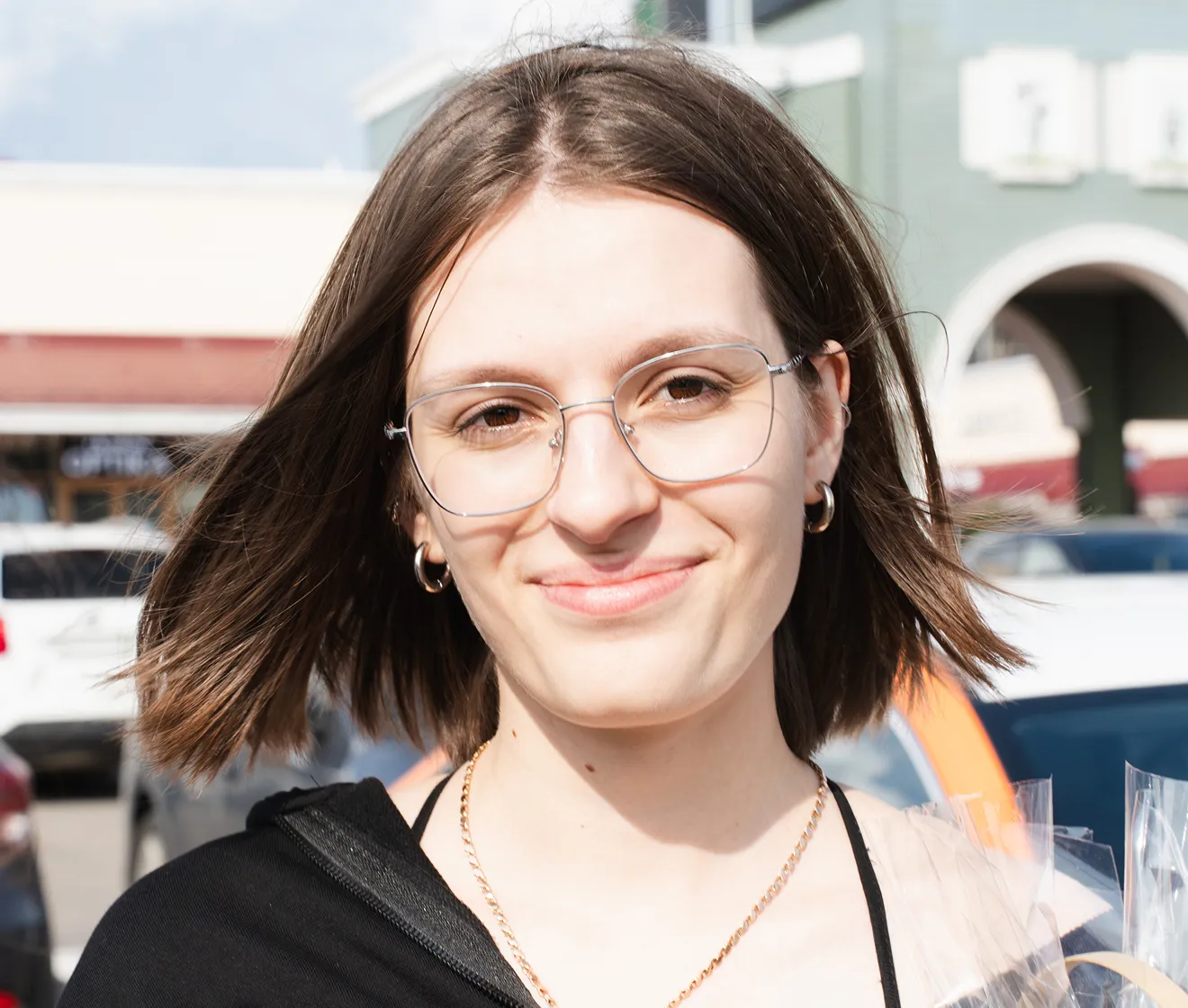 Evoto after example of the same outdoor portrait with open eyes behind glasses