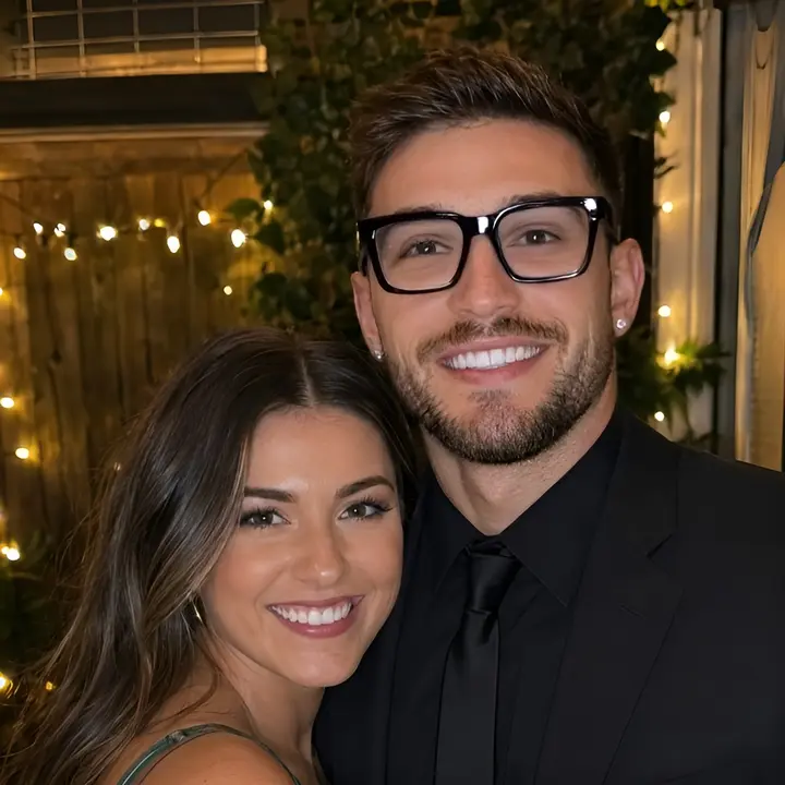 After glare removal: the same two-person portrait with reduced ring light reflections on the glasses
