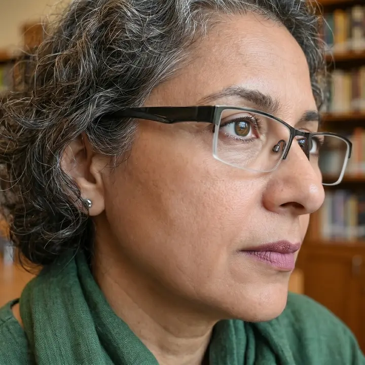 After glare removal: the same close-up portrait with clearer eyes behind the lenses