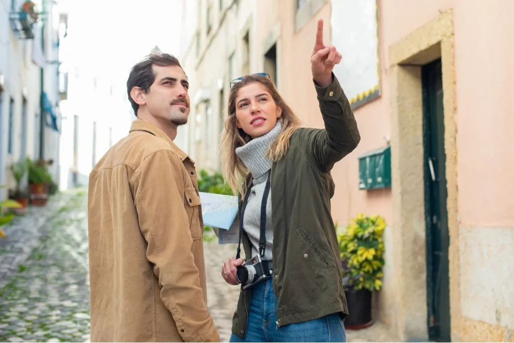 Before: a man and woman standing together in a narrow street